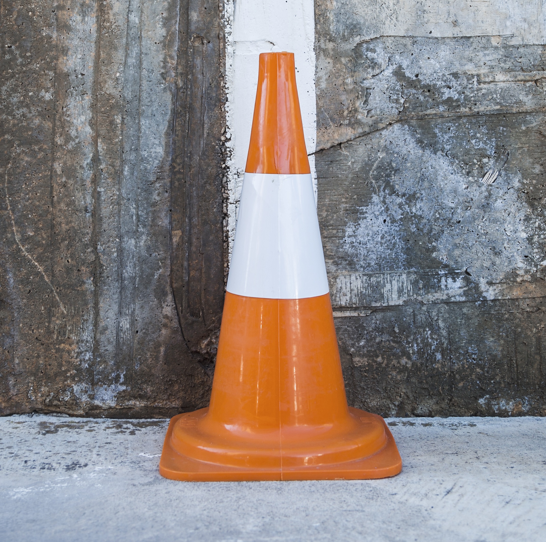 traffic cone against wall